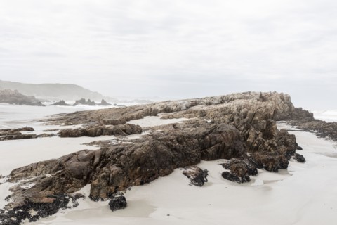 Rock formations on Voelklip Beach