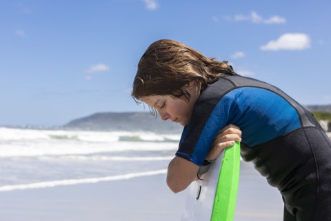 Boy with bodyboard on Grotto Beach