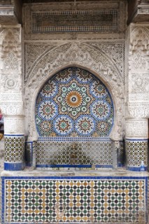 Traditional Moroccan tiled fountain in medina