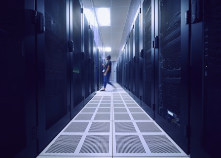 Female technician walking in server room