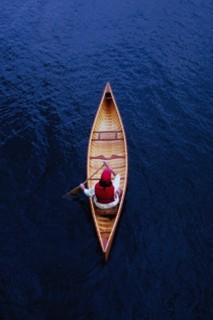 Overhead view of woman paddling canoe on Lake Placid