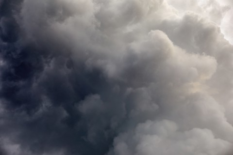 Dramatic gray storm clouds on sky