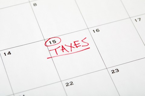 Tax day marked on wall calndar in red