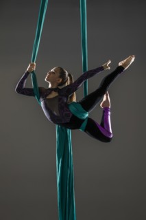 Teenage girl (14-15) practicing aerial silk