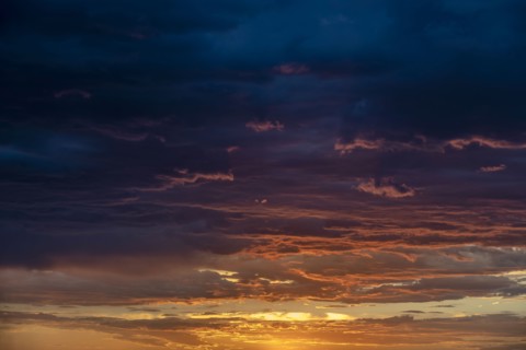 Dramatic storm clouds at sunset