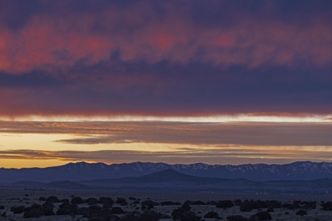 Dramatic sunset sky over Cerrillos Hills State Park desert landscape