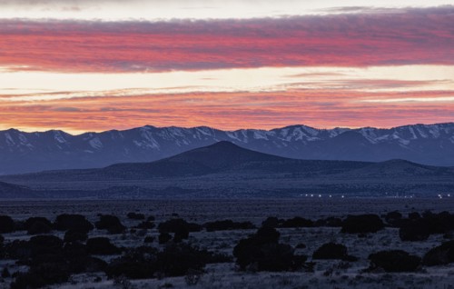 Dramatic sunset sky over Cerrillos Hills State Park desert landscape