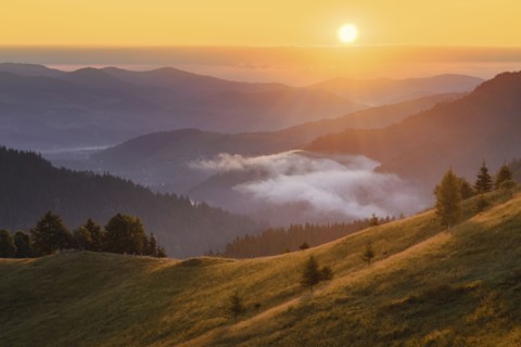 Rolling landscape in Carpathian Mountains at sunset