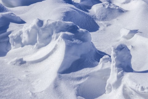 Close-up of snow formations on sunny day