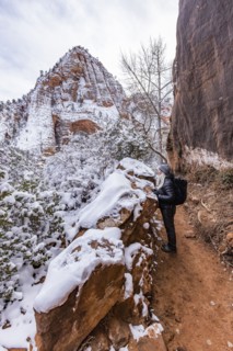 Senior woman hiking in mountains in winter