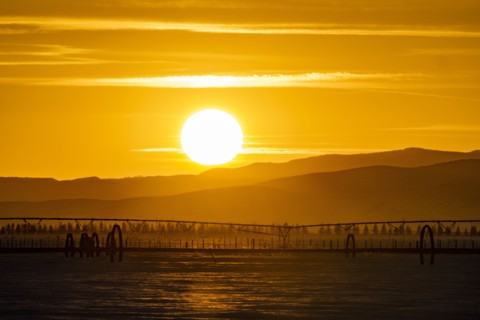 Sunset over hilly landscape