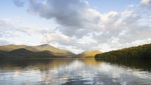 Lake Placid reflecting Whiteface Mountain and clouds