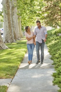 Smiling couple holding hands