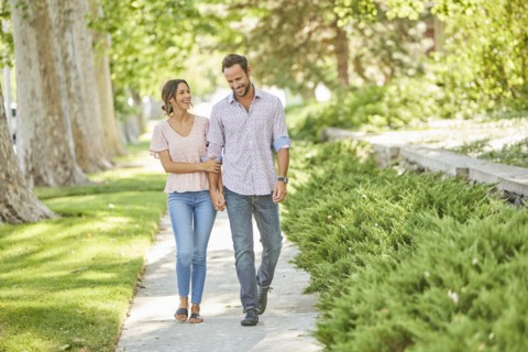 Smiling couple holding hands