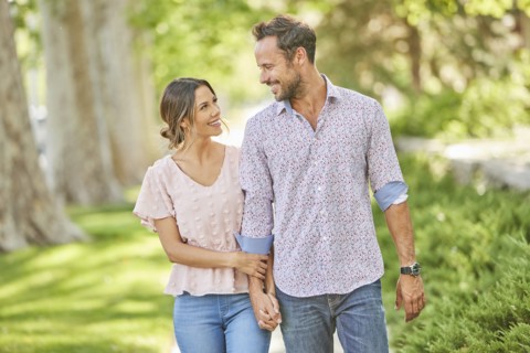 Smiling couple holding hands