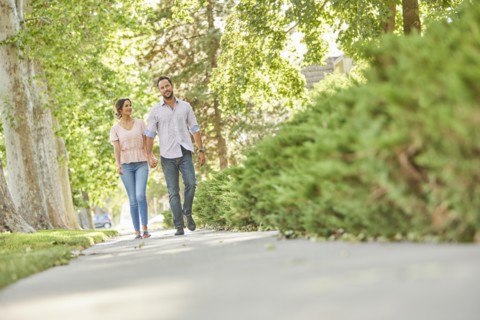 Smiling couple holding hands