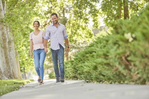 Smiling couple holding hands