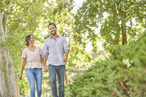 Smiling couple holding hands