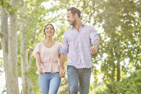 Smiling couple holding hands