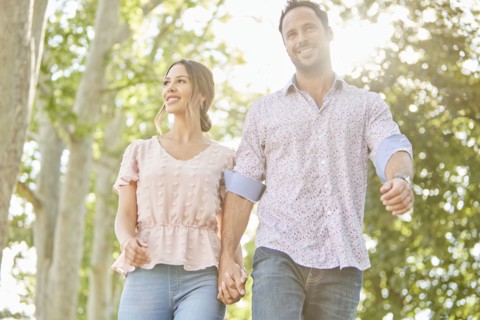 Smiling couple holding hands