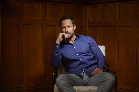 Portrait of mid adult man sitting on chair