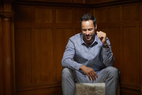 Smiling mid adult man sitting on chair