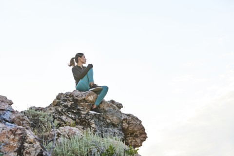 Mid adult woman hiking in mountains