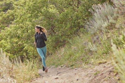 Mid adult woman jogging outdoors