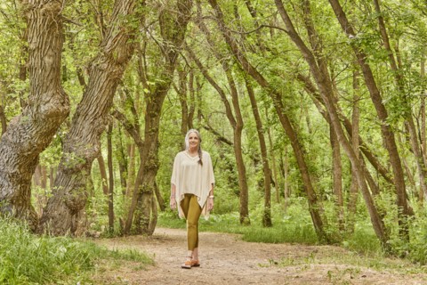 Smiling mature woman walking in park