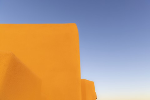 Adobe walls against blue sky