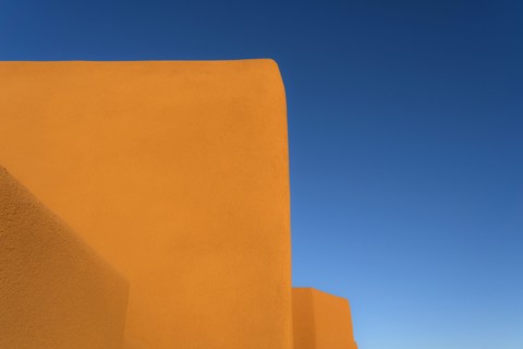 Adobe walls against blue sky