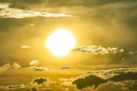Sky with clouds and setting sun