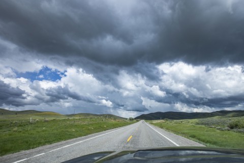 Storm clouds gathering above highway