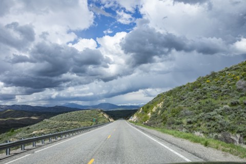 Storm clouds gathering above highway