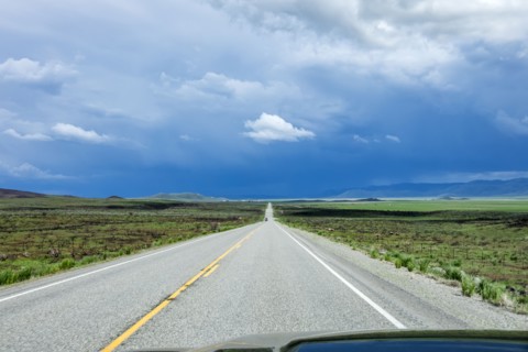 Storm clouds gathering above highway