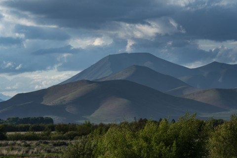 Clouds above mountains at sunset