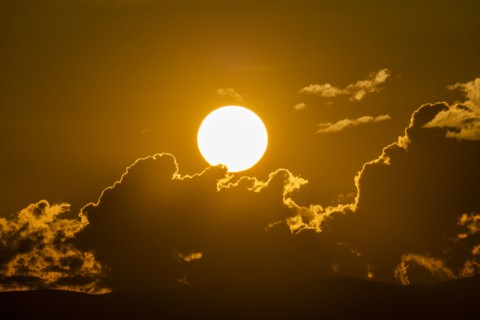 Sky with clouds and setting sun