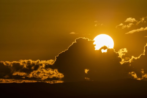 Sky with clouds and setting sun
