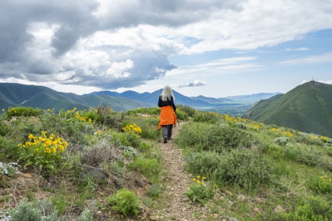 Senior blonde woman hiking on Carbonate Mountain trail