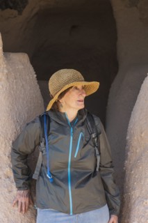 Woman in straw hat at Puye Cliff Dwelling