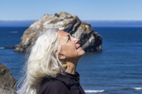 Side view of senior woman with long hair