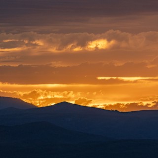 Beautiful sunset over silhouettes of mountains
