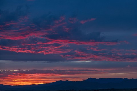 Beautiful sunset over silhouettes of mountains