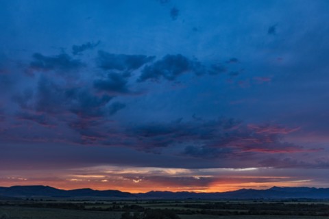 Beautiful sunset over silhouettes of mountains