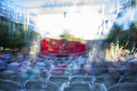 Blurred motion of stage at outdoor theater at dusk