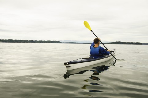 Man kayaking on lake
