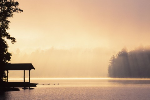 Morning mist above Lake Placid at sunrise in Adirondack Mountains, Lake Placid, New York, USA