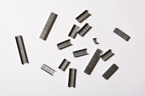 Overhead view of staples on white background, New York, NY, USA