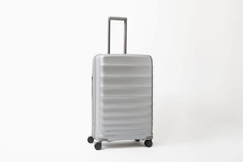 Studio shot of silver rolling suitcase, New York, NY, USA