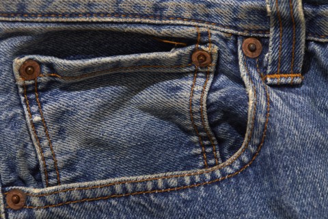 Close-up of pocket on worn jeans, new York, NY, USA